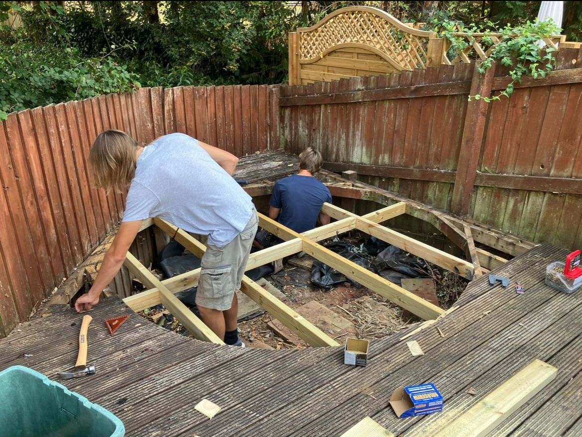 New treated timber decking sub-frame being built over the stripped-out old deck by AJW Carpentry