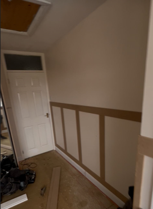 Close-up of a precision-mitred skirting board corner joint fitted by AJW Carpentry in Sidmouth